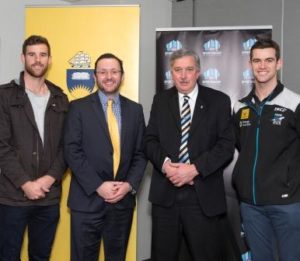 L-R: Crows player Andy Otten, AFL SportsReady CEO James Montgomery, Professor Andrew Parkin, and Port Adelaide player Marcus Drum.