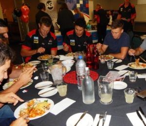 West Adelaide players tuck in at their menu launch last night. 
