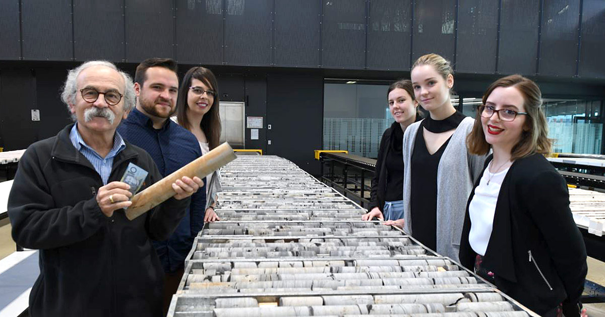 John Mignone, Department of State Development Mineral Resources Division Education and Community Information Services Manager, with five trainee science teachers from Flinders, left to right, Michael Bocse, Emily Halls, Kimberley Jackson, Hannah Wertheim and Emily Hawkins at the Drill Core Library at Tonsley.