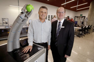 Flinders Professor John Spoehr and Volker Schmid of Festo with the Bionic Handling Assistant at the launch of the Tonsley Manufacturing Innovation (TMI) Hub.
