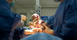 Newborn baby in delivery room.Stock photo.