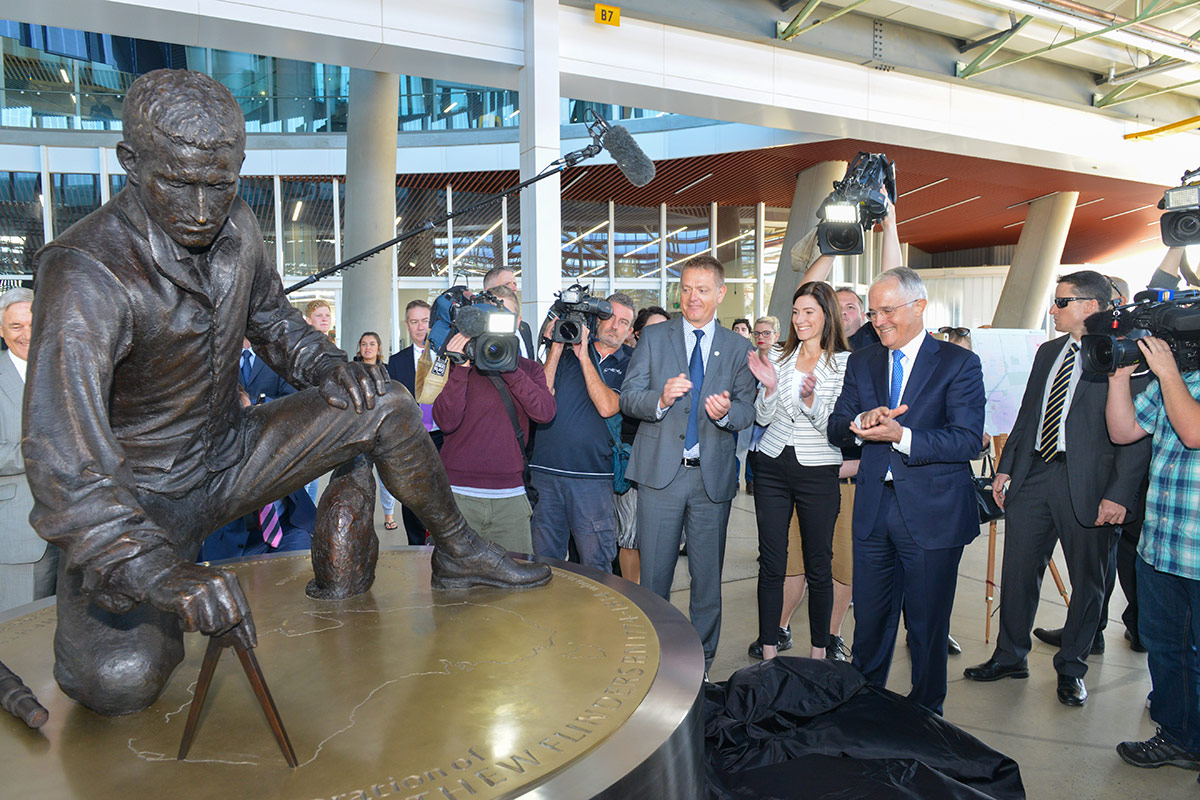 Vice-Chancellor Professor Colin Stirling (centre) and then Prime Minister Malcolm Turnbull at the unveiling of full-size replica statue of Matthew Flinders at Flinders University's Tonsley campus in 2016. Photo: Brenton Edwards for Flinders University